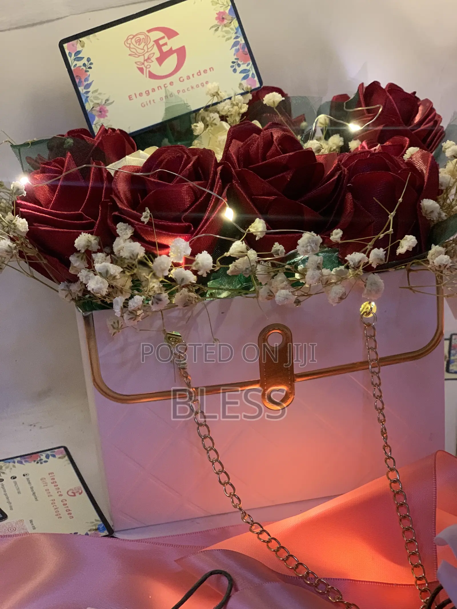 Red And White Ribbon Flowers With White Bag And Led Lights