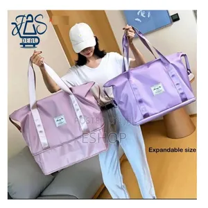 Photo - **Foldable Travel Bag – Handheld, Shoulder Luggage Strap**