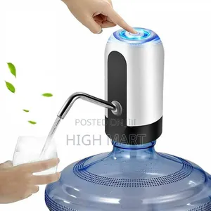 Photo - ከ"ጃር" ላይ የመጠጥ ዉሃ የሚስብ ተንቀሳቃሽ ማሽን