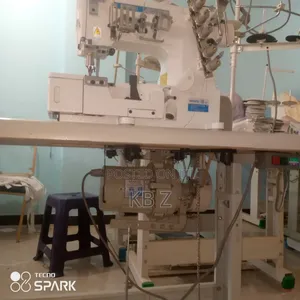 Photo - Garment Binding/Cover Machine