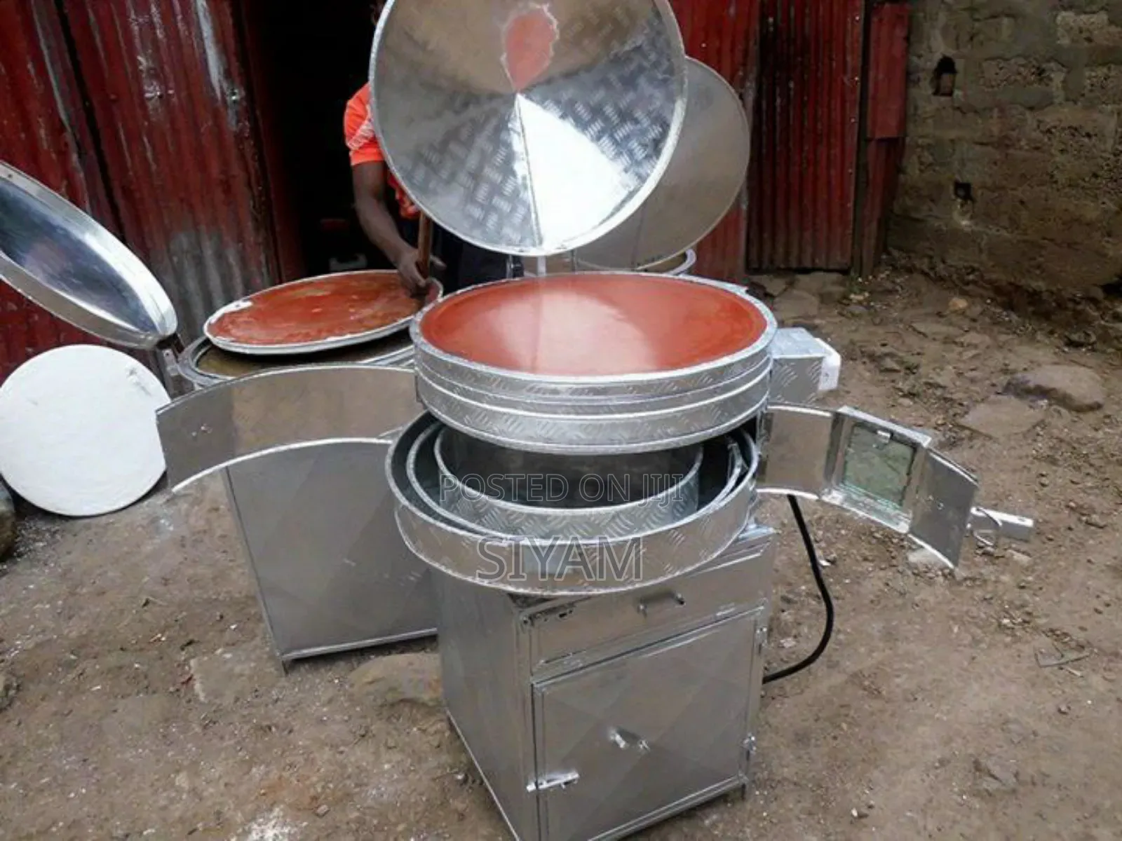 የእንጀራ መጋገሪያ ምጣድ እና ድፎ መድፊያ በአንድ ላይ