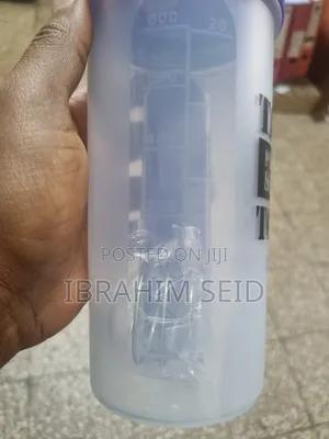 Shaker Bottle With a Wire Ball and Side Pill Organizer