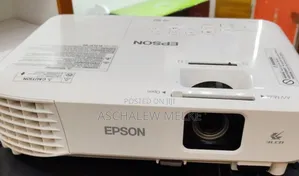 Photo - Epson Projector
Model Name: Eb-S05
With Bag and Remote 
H
