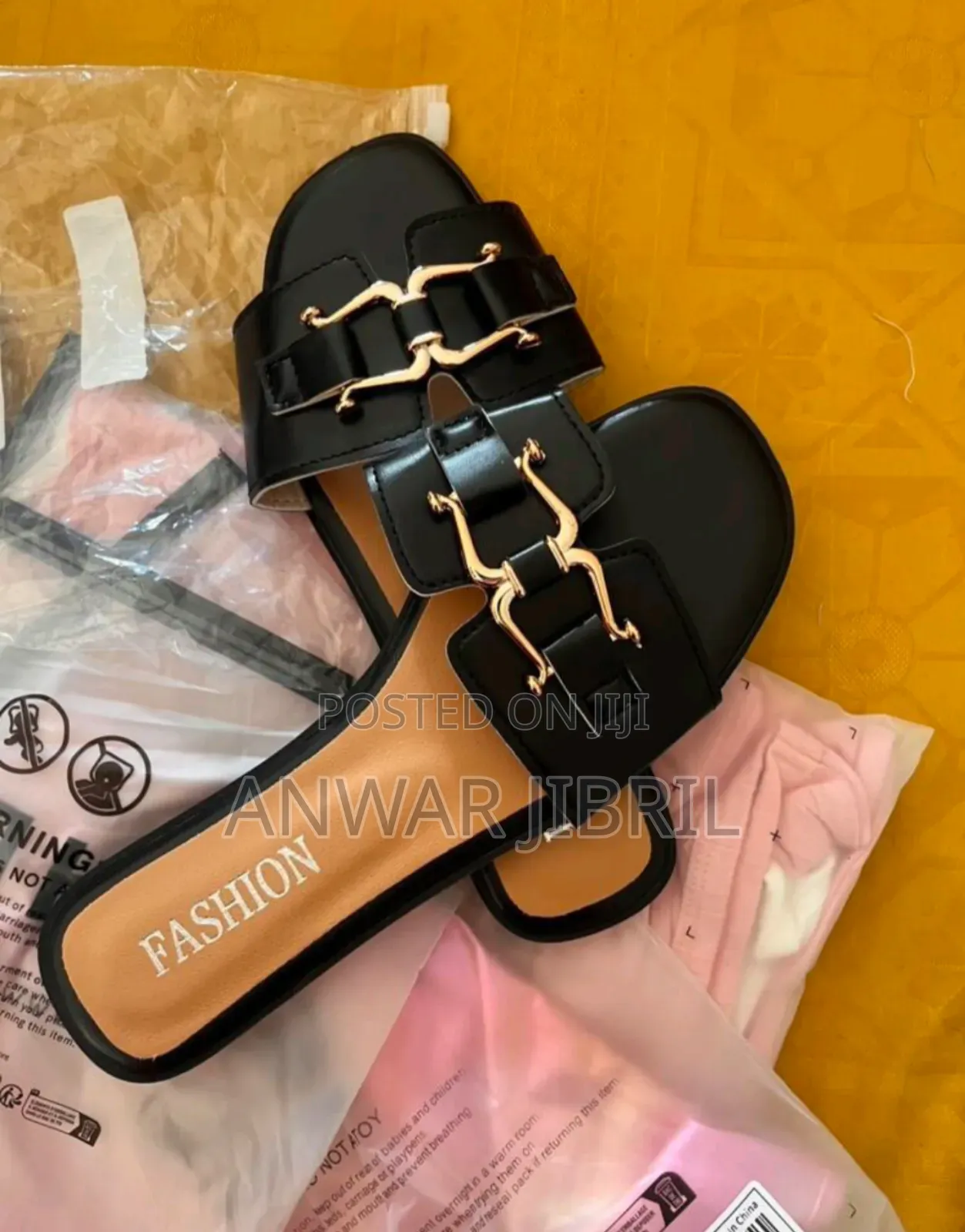 Elegant Black Slip-on Sandals- Gold Buckle Design