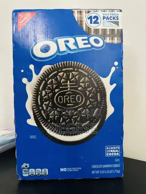 Photo - Cadbury Oreo Vanilla Flavour Crème Sandwich Biscuit Family