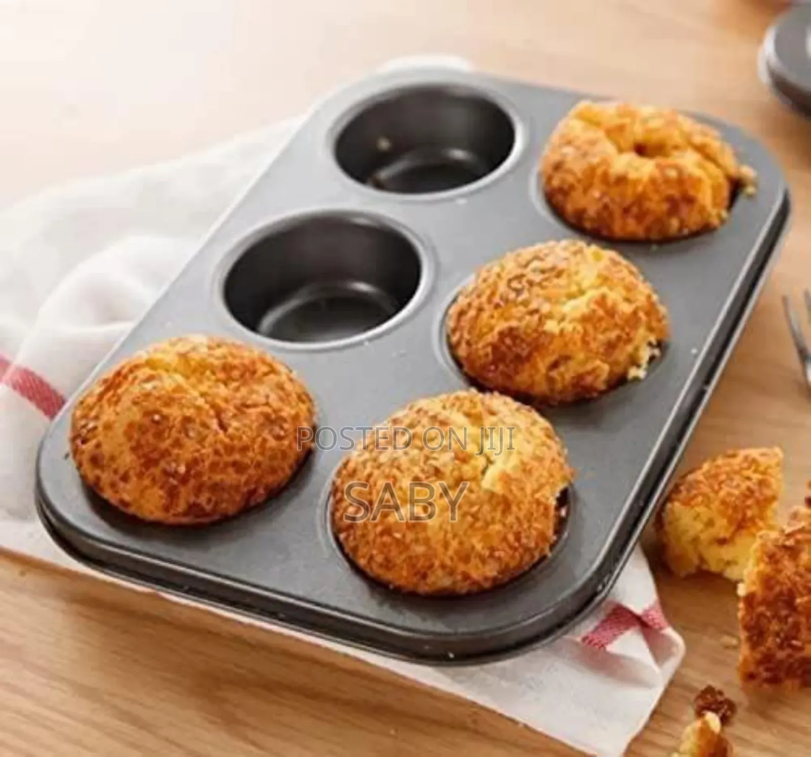 A Muffin Tin, Typically Used For Baking Muffins Or Cupcakes.