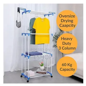 Photo - **Wide-Span 4-Tier Airer – Fits Bulk Laundry Loads**