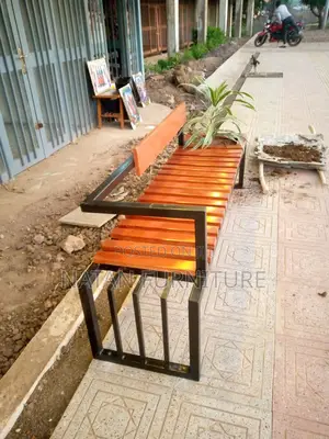 Modern Outdoor Bench With a Metal Frame and Wooden Slats