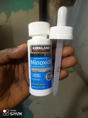 Photo - Droplet Liquid Kirkland Organic Hair Oil.