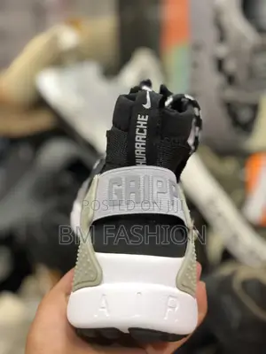 Men's Nike Air Huarache Gripp Sneakers in Black/White.