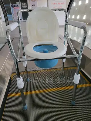 Photo - Plastic Commode Chair, 營دaged Cares People Disabilities