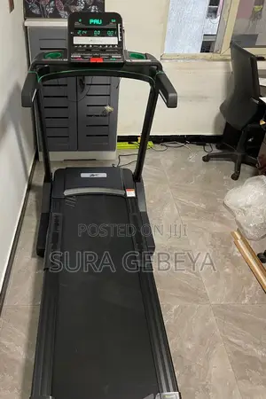 Photo - Modest Home Gym Reebok Treadmills (Bole)