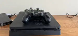 Photo - Ps4 Slim With Two Controllers and 4 Games