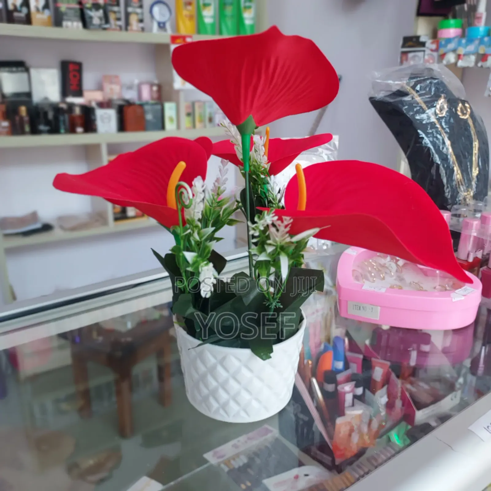 Vibrant Red Artificial Flower In Elegant White Pot