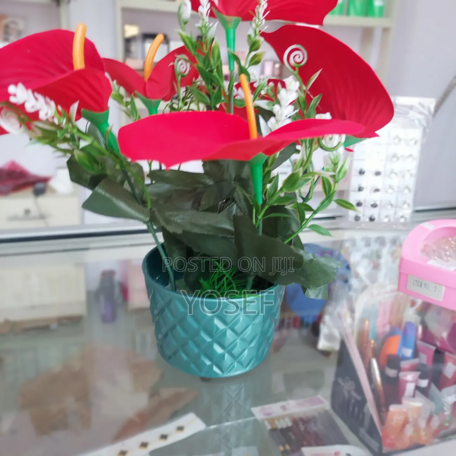 Vibrant Red Artificial Flower In Elegant White Pot