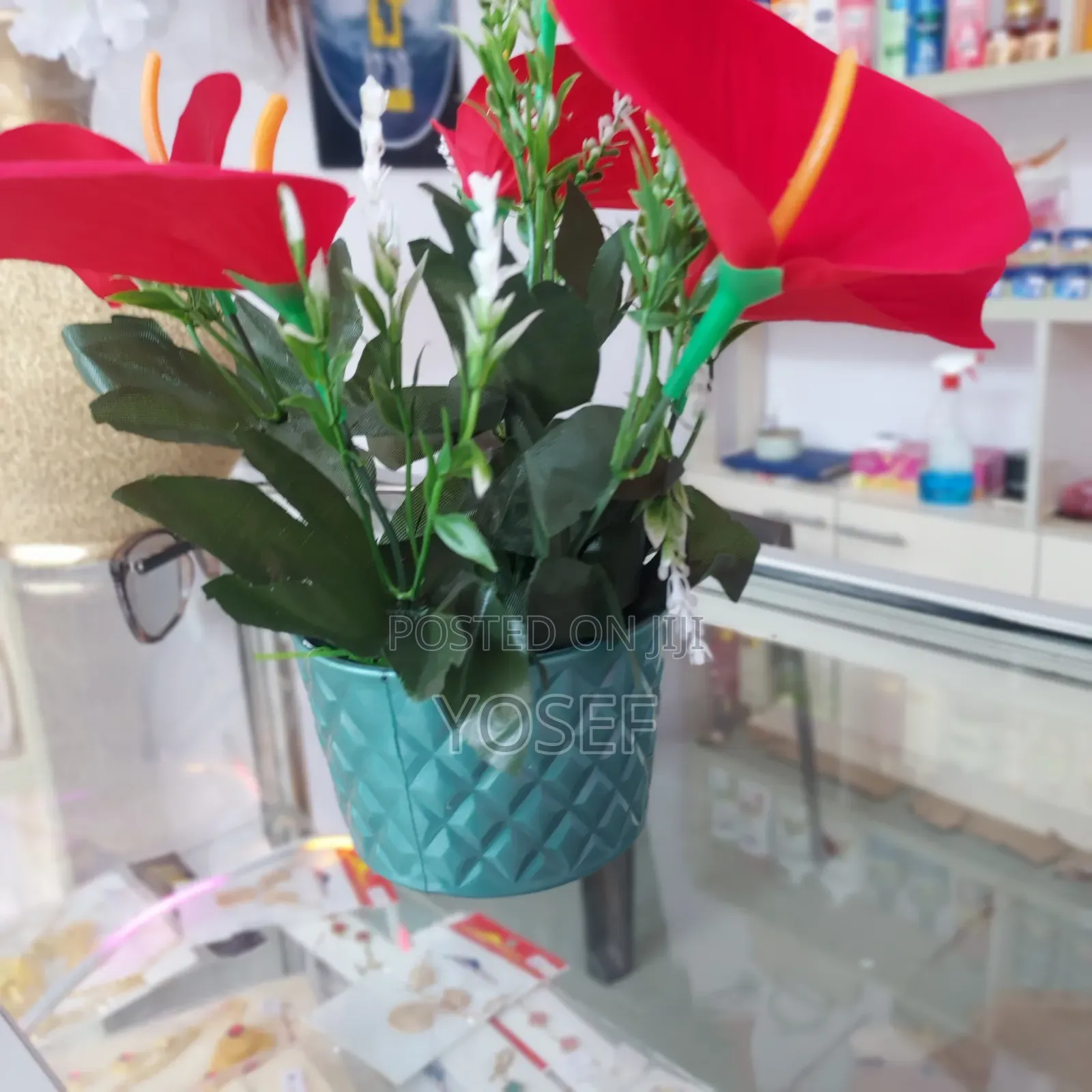 Vibrant Red Artificial Flower In Elegant White Pot