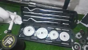 Photo - ሁሉን በአንድ የያዘ ዳንፔልና ባርቤል( 55 Kg York Set)