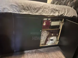 2 Black Bed Side Tables With Wheels Both With King Size Bed
