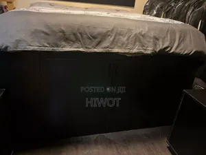 2 Black Bed Side Tables With Wheels Both With King Size Bed