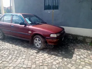 Photo - Toyota Corolla Sedan 1990 Burgundy