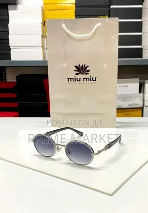 Photo - Miu Miu Oval Sunglasses