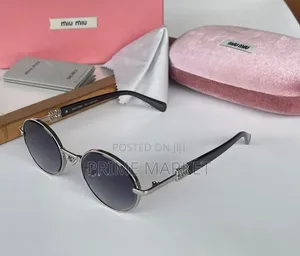 Miu Miu Oval Sunglasses