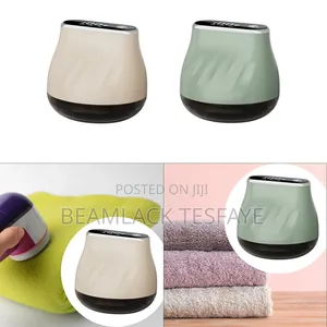 Rechargeable Fabric Shaver, Also Known as a Lint Remover or Defuzzer.