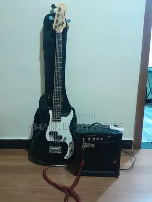 Photo - Bass Guitar With Bass Amplifier