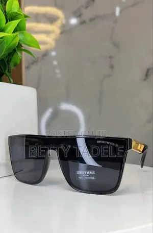 Photo - Sunglasses on Hand
