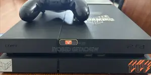 Photo - Ps4 1 Terabytes With PSN Account, CDS and Controllers