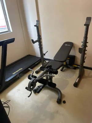 Photo - Miracle Fitness Adjustable Bench With Leg Extension and Barbells Rack
