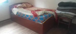 Photo - Wooden Bed