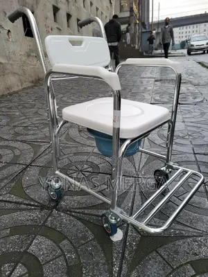 Photo - Wheeled Commode Chair戒πdirectly Over a Toilet for Safer Toileting