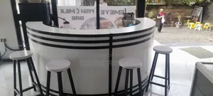 Cafe Bar and Chairs With Their Tables