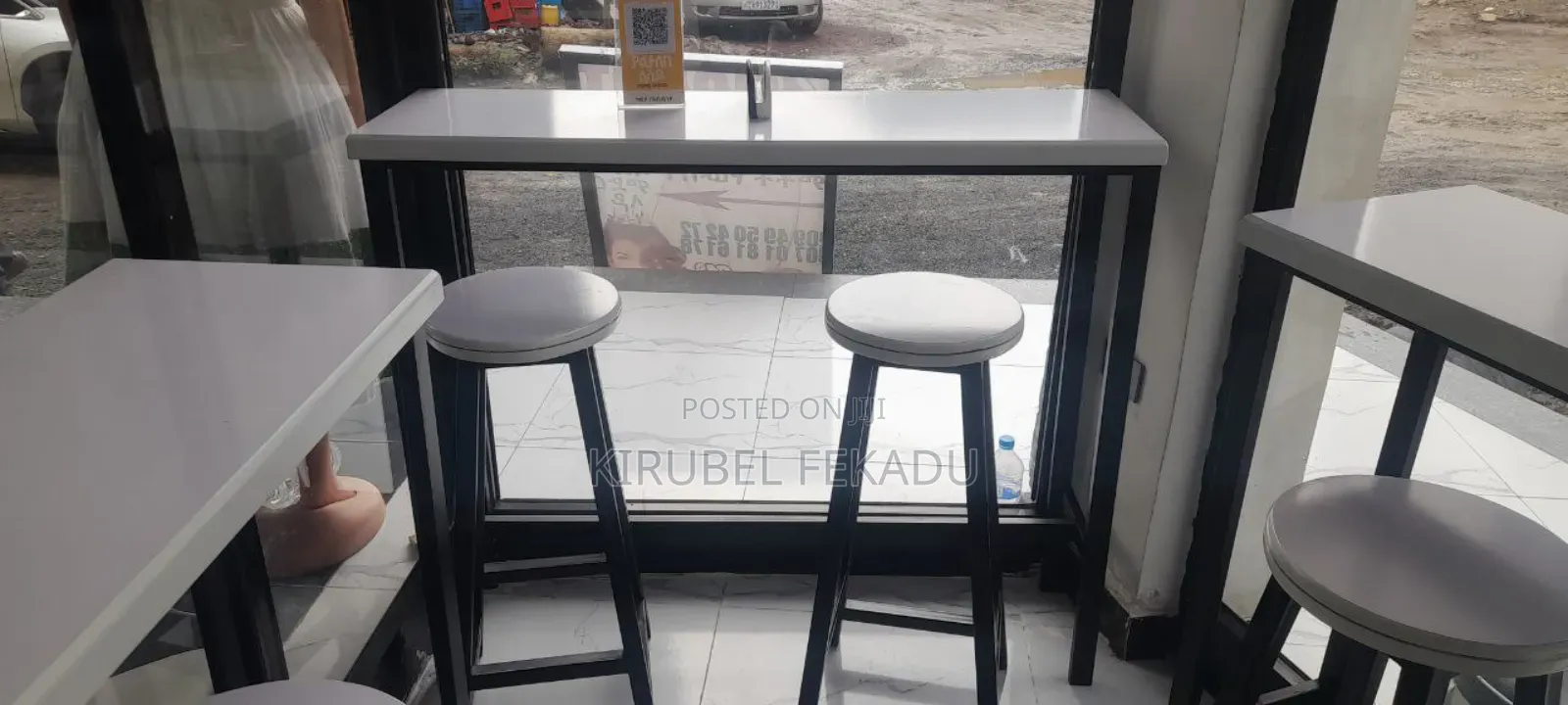 Cafe Bar and Chairs With Their Tables