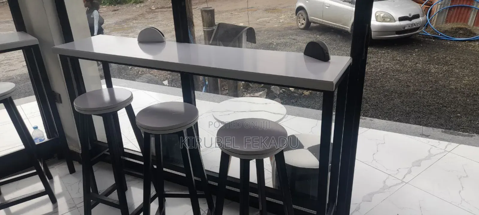 Cafe Bar and Chairs With Their Tables