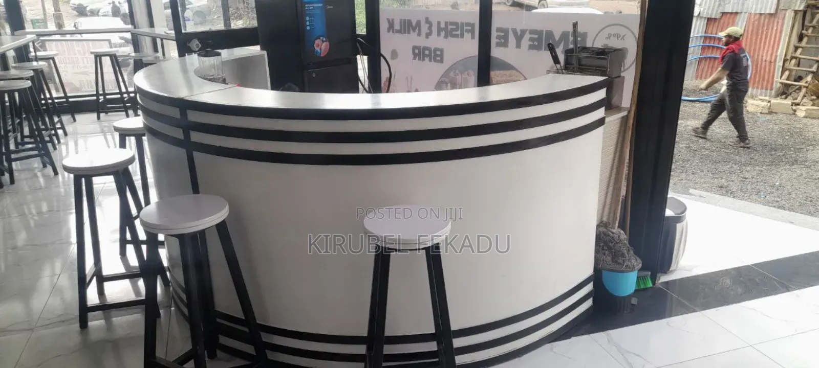 Cafe Bar and Chairs With Their Tables