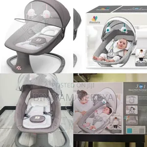 Photo - New Baby የራሱ ሪሞት ያለው ሙዚቃዎች ያሉት Mastela 3-in-1deluxe Bassinet/Swing