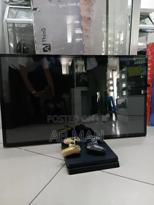 Photo - Ps4 Slim and Smart Tv