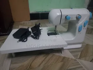 Photo - Mini Electric Sewing Machine