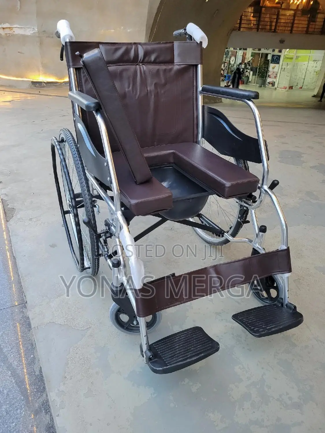 Toilet Wheelchair增琳image Shows a New, Standard Manual Wheelchair.