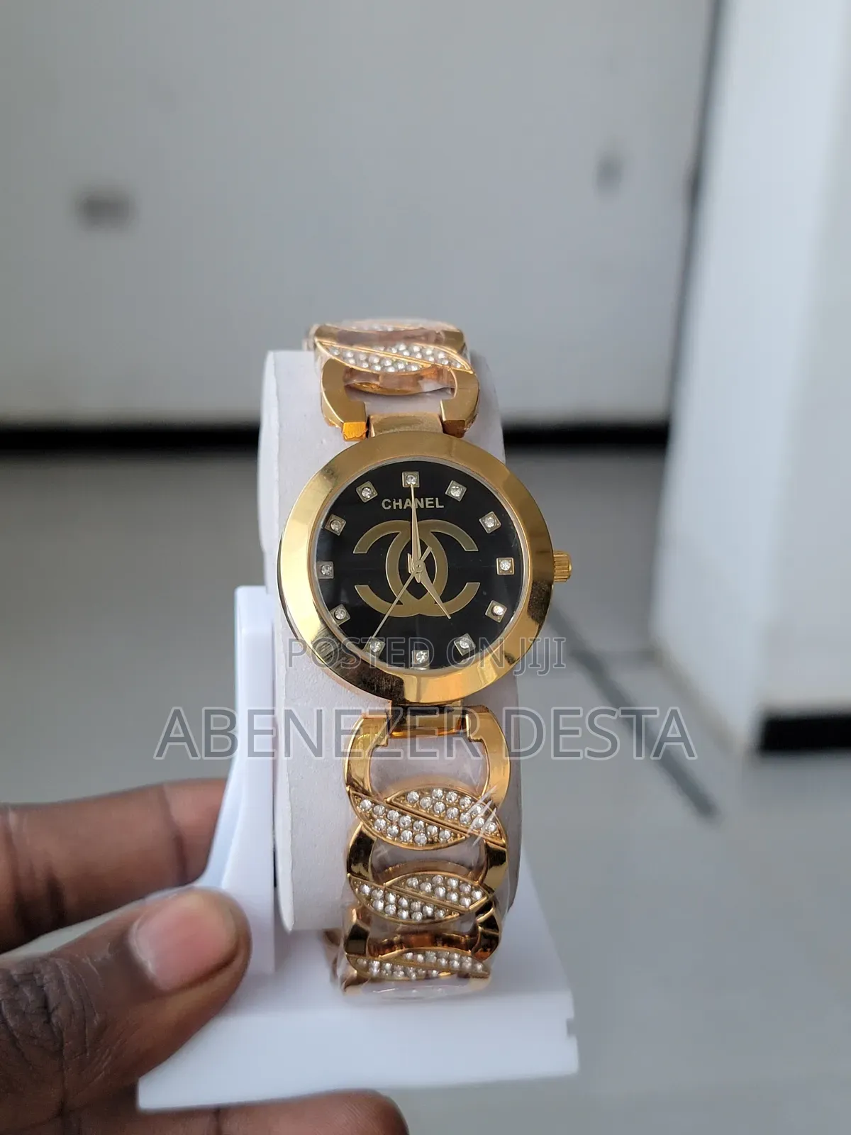 Ladies Watch Chanel Watch With a Gold-Plated Band and a Black Face