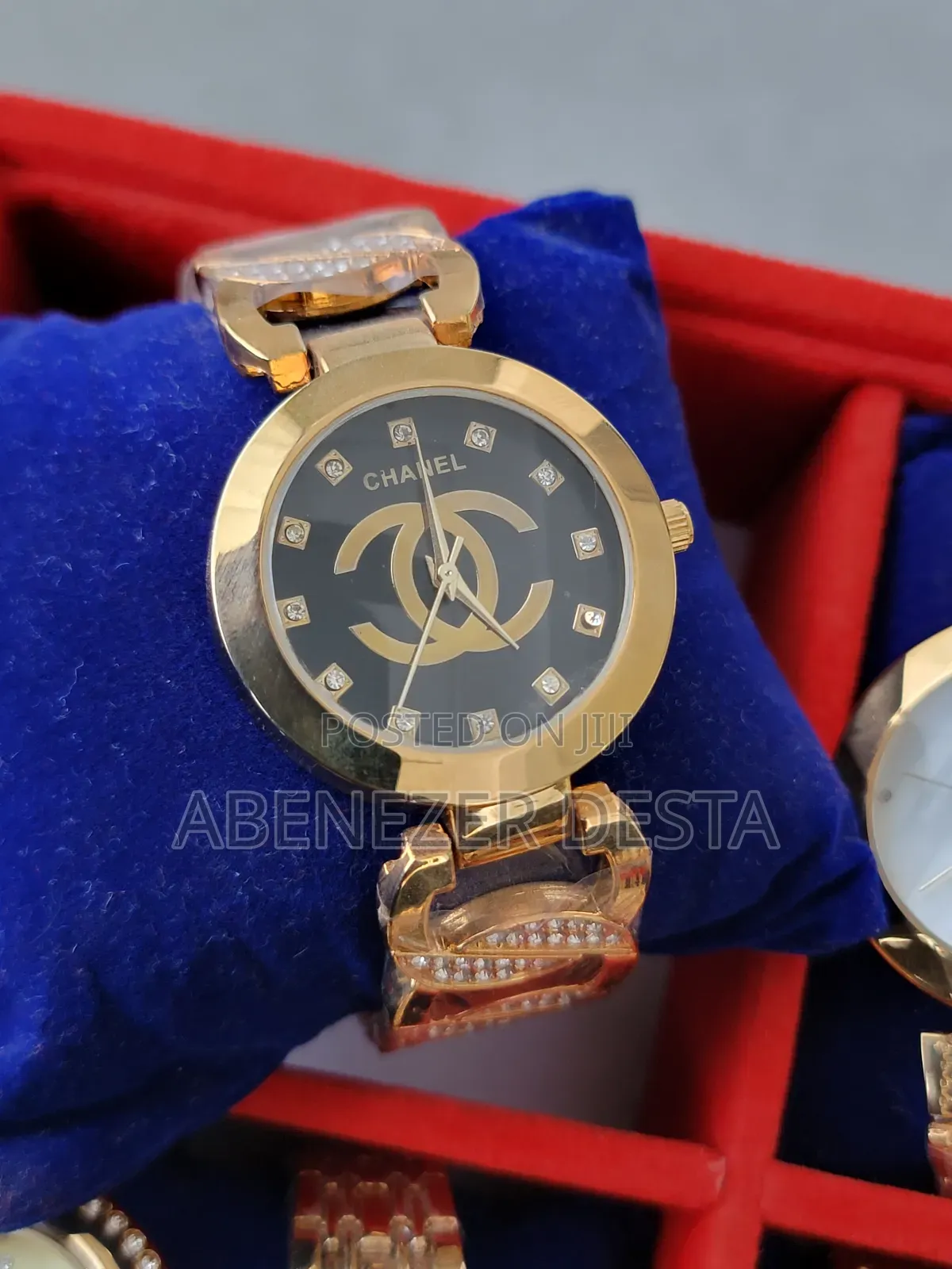 Ladies Watch Chanel Watch With a Gold-Plated Band and a Black Face