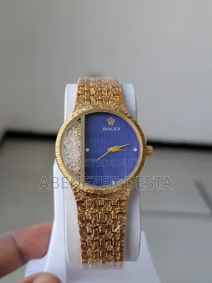 Photo - Gold Rolex Watch With a Blue Dial and Diamond