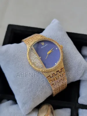 Gold Rolex Watch With a Blue Dial and Diamond