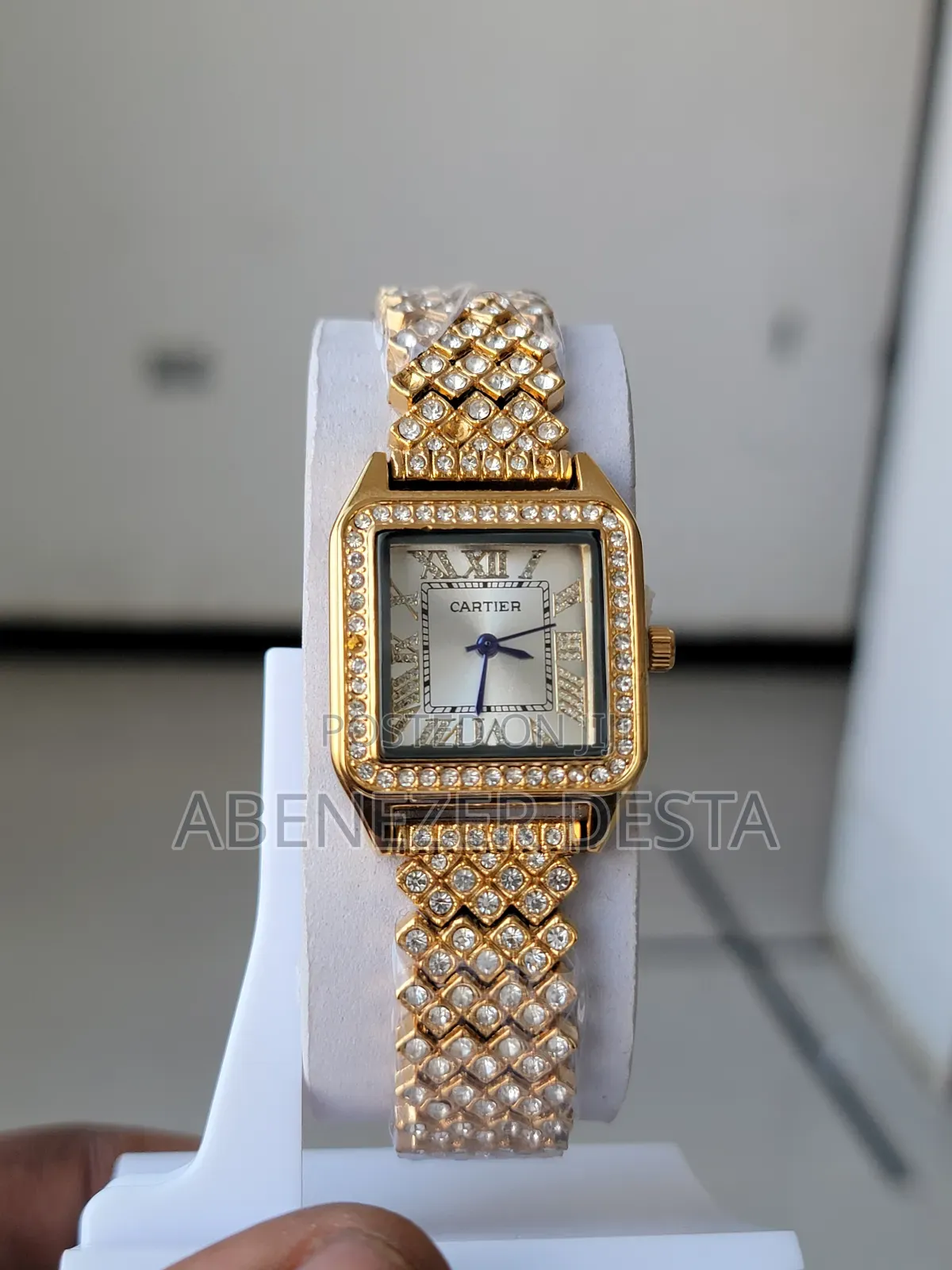 Gold-Colored, Square-Faced Women's Wristwatch With a Sparkling
