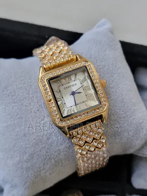 Gold-Colored, Square-Faced Women's Wristwatch With a Sparkling