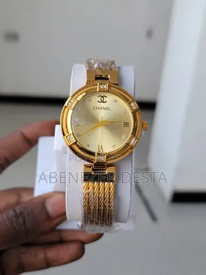 Photo - A Gold-Toned Chanel Women's Watch With a Braided Metal Band