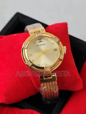 A Gold-Toned Chanel Women's Watch With a Braided Metal Band