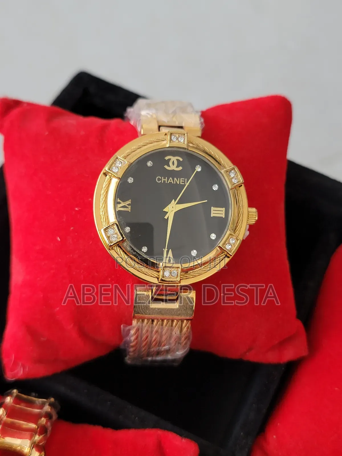 Chanel Watch With a Gold-Toned Case and Band, a Black Dial